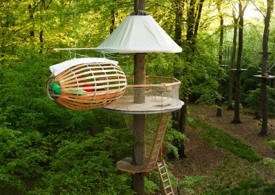 A place to sleep hangs from a tree house