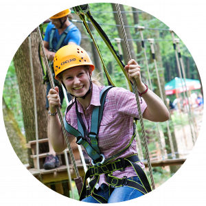 A guest climbs an element in a climbing forest